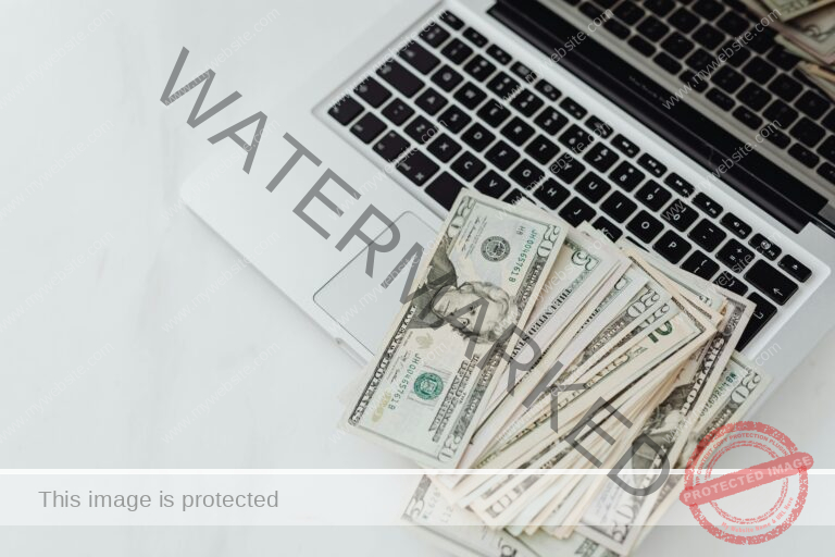 Laptop with money on it showing Revenue Potential